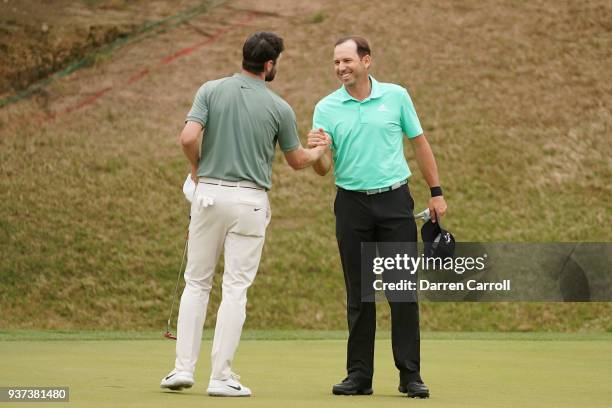 Kyle Stanley of the United States shakes hands with Sergio Garcia of Spain after defeating him 3&1 on the 17th green during the fourth round of the...