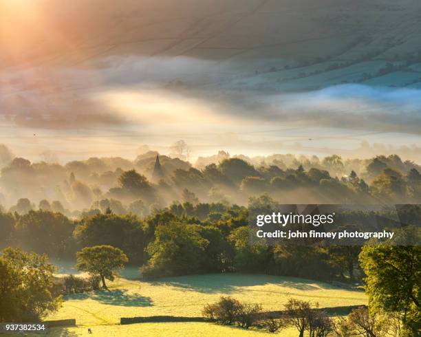 edale village sunrise with mist and fog and golden light at sunrise. english peak district. uk. - english village stock pictures, royalty-free photos & images