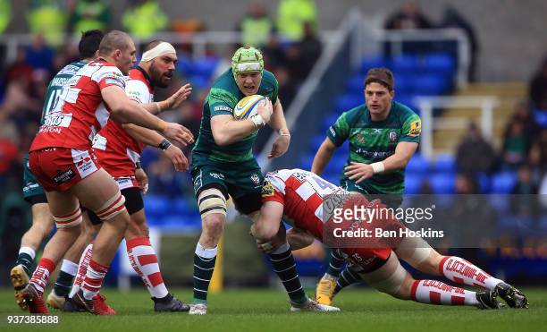 Conor Gilsenan of London Irish is tackled by Tom Savage of Gloucester during the Aviva Premiership match between London Irish and Gloucester Rugby at...