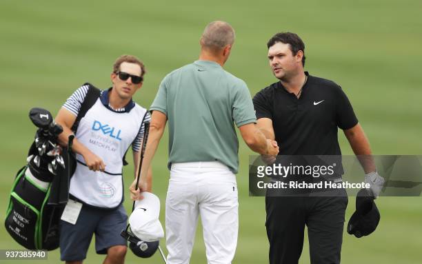 Alexander Noren of Sweden shakes hands with Patrick Reed of the United States after defeating him 5&3 on the 15th green during the fourth round of...