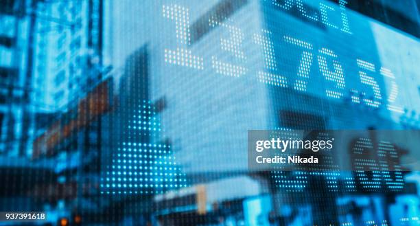 financial stock market numbers and city light reflection - trading screen stock pictures, royalty-free photos & images