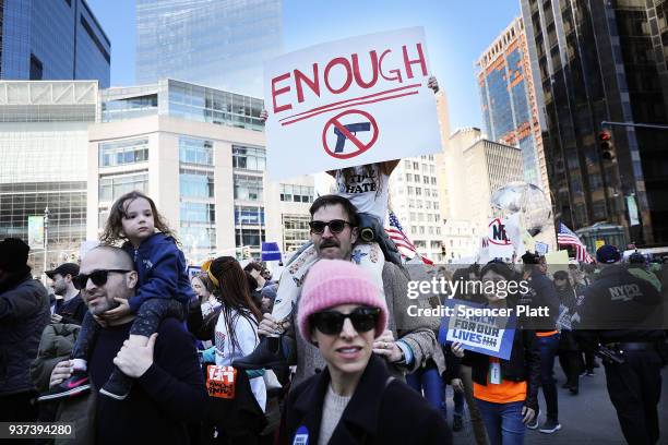 Thousands of people, many of them students, march against gun violence in Manhattan during the March for Our Lives rally on March 24, 2018 in New...