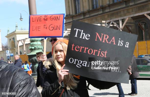 Demonstrators protest at the 'March for our Lives' gathering on March 24, 2018 in Munich, Germany. They protested for gun control and to remember the...