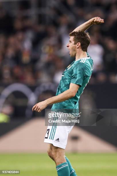 Thomas Mueller of Germany celebrates after he scores the equalizing goal to make it 1-1 during the International friendly match between Germany and...