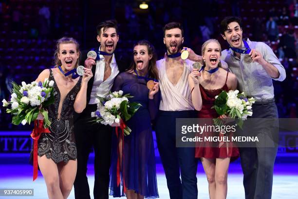 Second-placed US silver medallists Madison Hubbell and Zachary Donohue, first-placed France gold medallists Gabriella Papadakis and Guillaume...