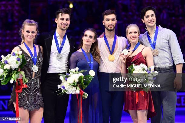 Second-placed US silver medallists Madison Hubbell and Zachary Donohue, first-placed France gold medallists Gabriella Papadakis and Guillaume...