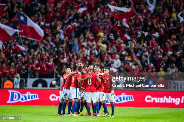 Arturo Vidal of Chile celebrates scoring the opening goal with teammates during an international friendly between Sweden and Chile at Friends arena...