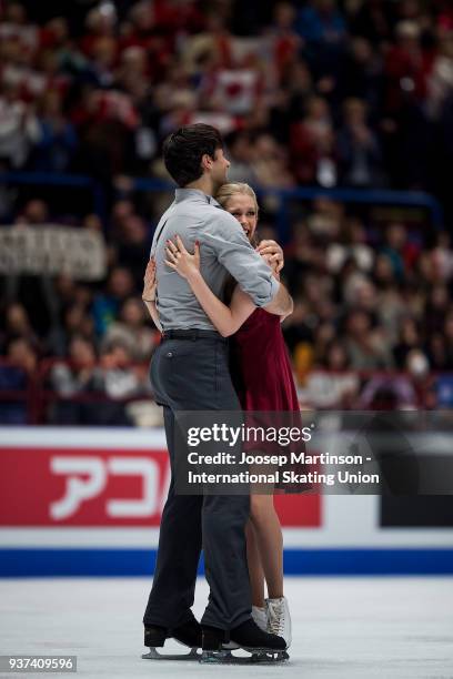 Kaitlyn Weaver and Andrew Poje of Canada react in the Ice Dance Free Dance during day four of the World Figure Skating Championships at Mediolanum...