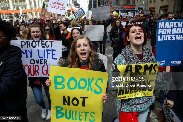 Protestors shout as they march down Sixth Avenue during the March For Our Lives, March 24, 2018 in New York City. Thousands of demonstrators,...
