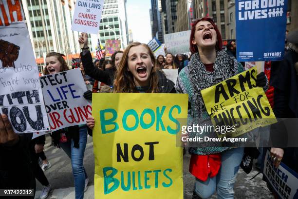 Protestors shout as they march down Sixth Avenue during the March For Our Lives, March 24, 2018 in New York City. Thousands of demonstrators,...