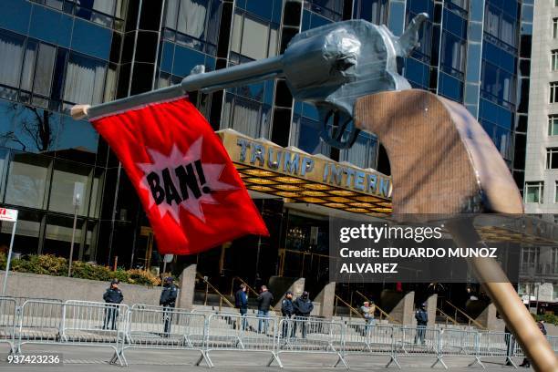 Officers stand guard at Trump international Hotel and Tower before the March for Our Lives Rally near Central Park West in New York on March 24,...