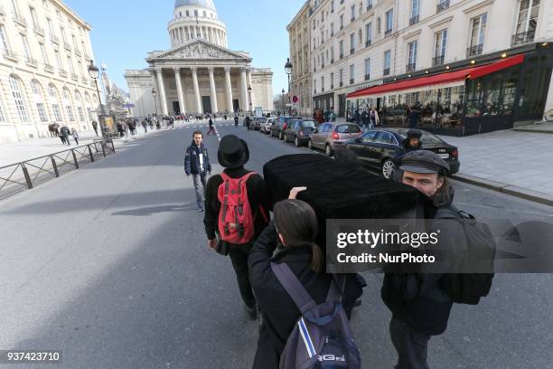 Teachers, parents and students carry a coffin as a symbol of the death of the French national Education at the base of the Pantheon in Paris, on...