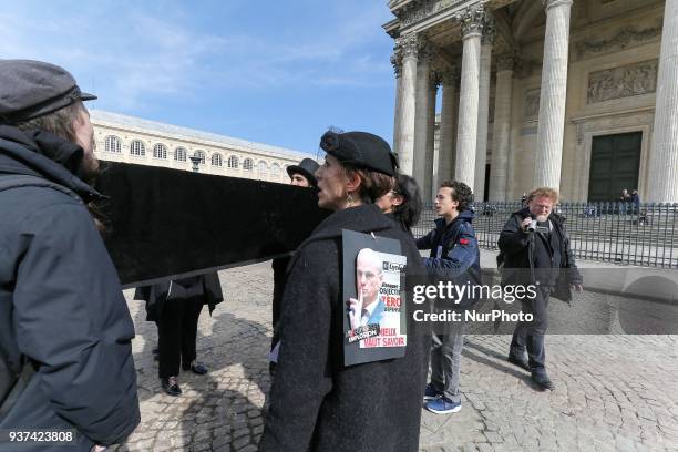 Protester holds a sign against French Education Minister Jean-Michel Blanquer during a demonstration where teachers, parents and students carry a...