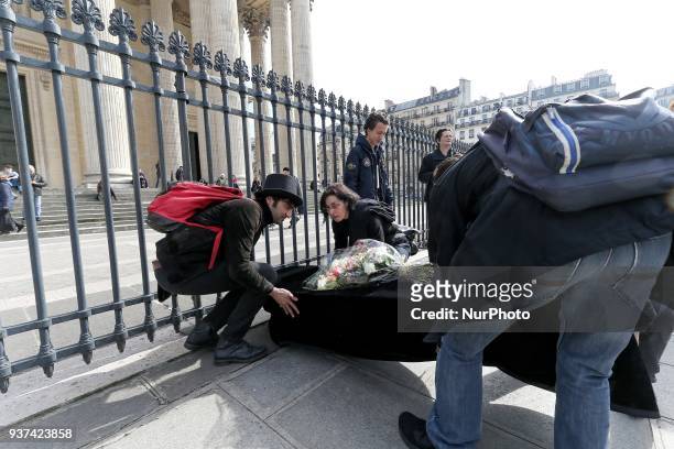 Teachers, parents and students lay down a coffin as a symbol of the death of the French national Education at the base of the Pantheon in Paris, on...