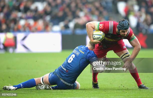 Nick Isiekwe of Saracens tackles James Horwill of Harlequins during the Aviva Premiership match between Saracens and Harlequins at London Stadium on...