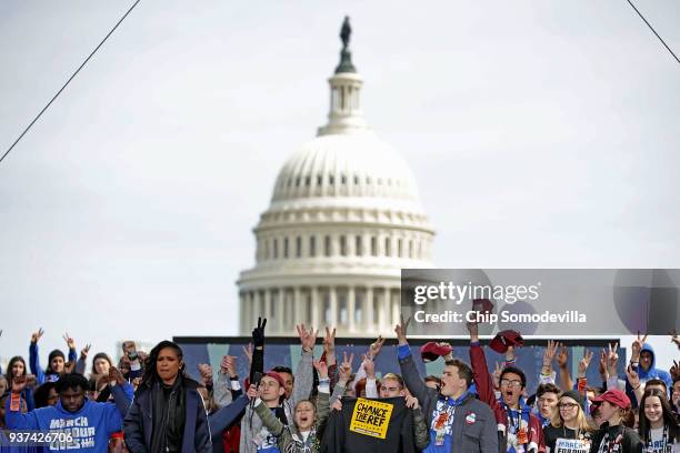 Young victims of gun violence, including students from Marjory Stoneman Douglas High School, stand together on stage at the conclusion of the March...