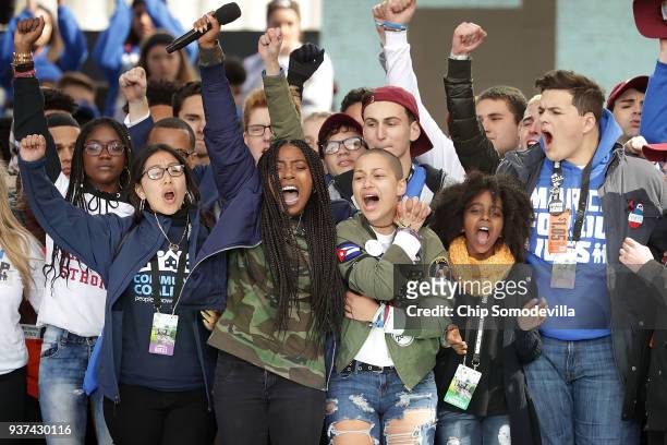 Students from Marjory Stoneman Douglas High School, including Emma Gonzalez , stand together on stage with other young victims of gun violence at the...