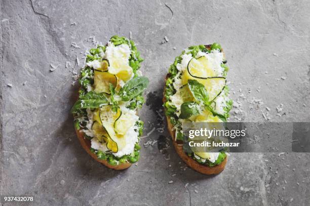 bruschetta with grilled zucchini, snow peas and mint, mozzarella and ricotta cheese - ciabatta stock pictures, royalty-free photos & images