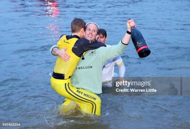 Members of the Cambridge University Boat Club celebrate after The Cancer Research UK Boat Race 2018 on March 24, 2018 in London, England. The...