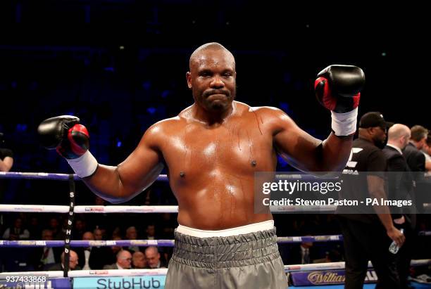 Dereck Chisora celebrates after knocking down Zakaria Azzouzi in the second round in the Heavyweight contest at the O2 Arena, London.