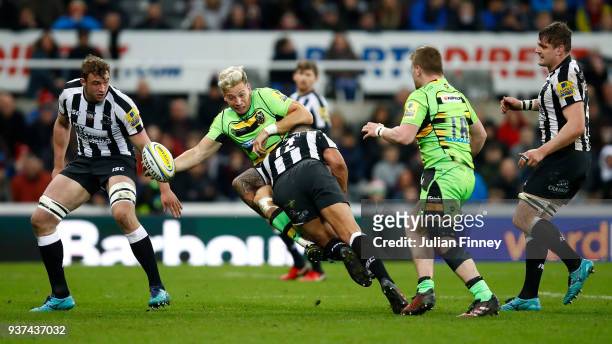 Harry Mallinder of Northampton is tackled by Josh Matavesi of Newcastle during the Aviva Premiership match between Newcastle Falcons and Northampton...