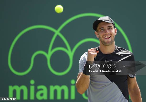 Borna Coric of Croatia celebrates match point against Leonardo Mayer of Argentina in their second round match during the Miami Open Presented by Itau...