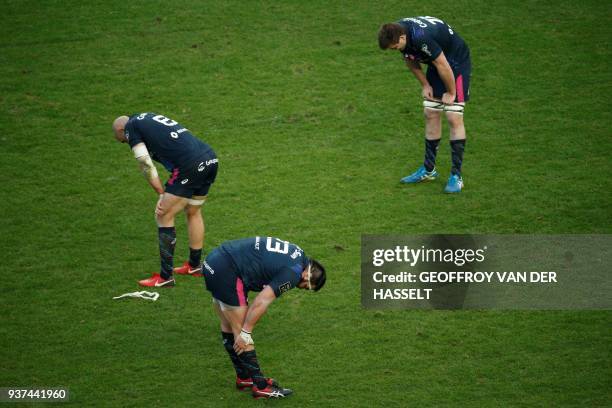 Stade Francais' players react at the end of the French Top 14 rugby union match between Stade Francais and Toulouse on March 24, 2018 at the Jean...