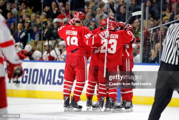 Celebrates the eventual game winner form Boston University Terriers defenseman David Farrance during an NCAA Northeast Regional semifinal between the...