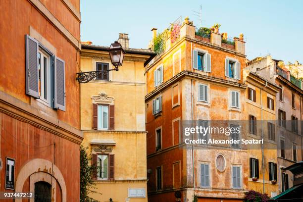 street in trastevere district in rome, italy - rome italy ストックフォトと画像