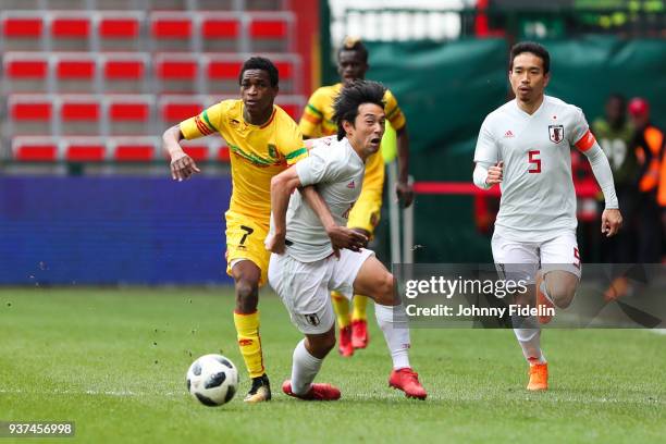 Souleymane Diarra of Mali and Shoya Nakajima of Japan during the International friendly match between Japan and Mali on March 23, 2018 in Liege,...