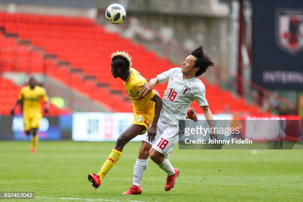 Falaye Sacko of Mali and Shoya Nakajima of Japan during the International friendly match between Japan and Mali on March 23, 2018 in Liege, Belgium.
