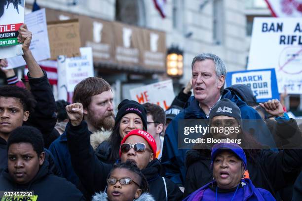 Bill de Blasio, mayor of New York City, center, gathers with demonstrators near Central Park during the March For Our Lives in New York, U.S., on...