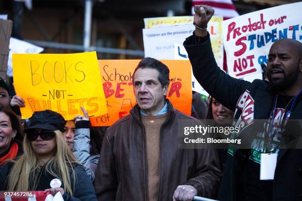 Andrew Cuomo, governor of New York, center, gathers with demonstrators near Central Park during the March For Our Lives in New York, U.S., on March...