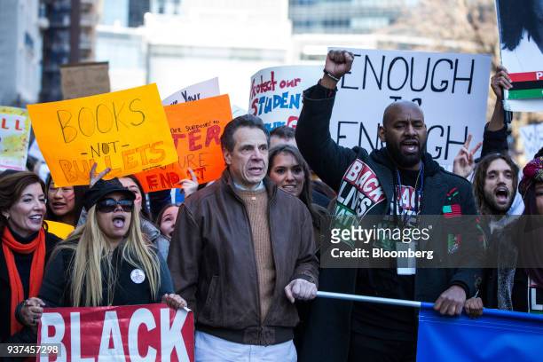 Andrew Cuomo, governor of New York, center left, gathers with demonstrators near Central Park during the March For Our Lives in New York, U.S., on...
