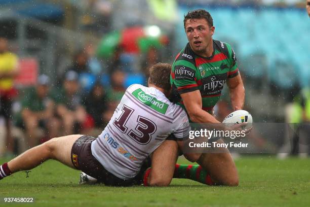 Sam Burgess of the Rabbitohs is tackled during the round three NRL match between the South Sydney Rabbitohs and the Manly Sea Eagles at ANZ Stadium...