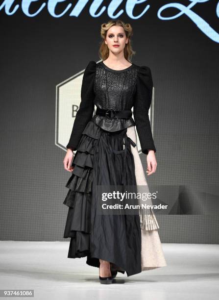 Model walks the runway wearing Queenie Zoe by Bomin Kim at 2018 Vancouver Fashion Week - Day 4 on March 22, 2018 in Vancouver, Canada.