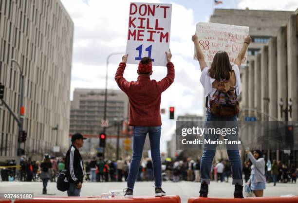 Girl holds a sign reading 'Don't Kill Me I'm 11' during the March for Our Lives rally on March 24, 2018 in Los Angeles, United States. More than 800...