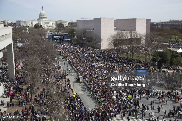 Demonstrators gather on Pennsylvania Avenue as the U.S. Capitol building stands in the background during the March For Our Lives in Washington, D.C.,...