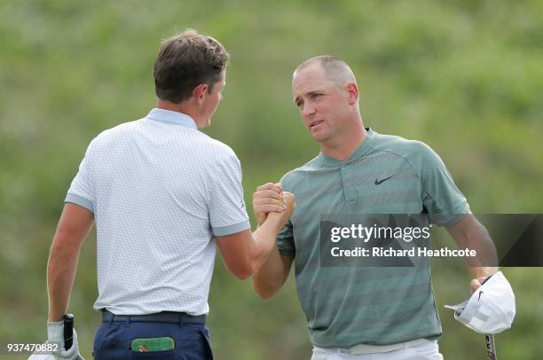 Alexander Noren of Sweden shakes hands with Cameron Smith of Australia after defeating him 4&2 on the 16th green during the quarterfinal round of the...