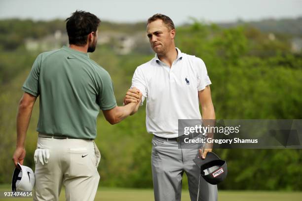 Justin Thomas of the United States shakes hands with Kyle Stanley of the United States after defeating him 2&1 on the 17th green during the...