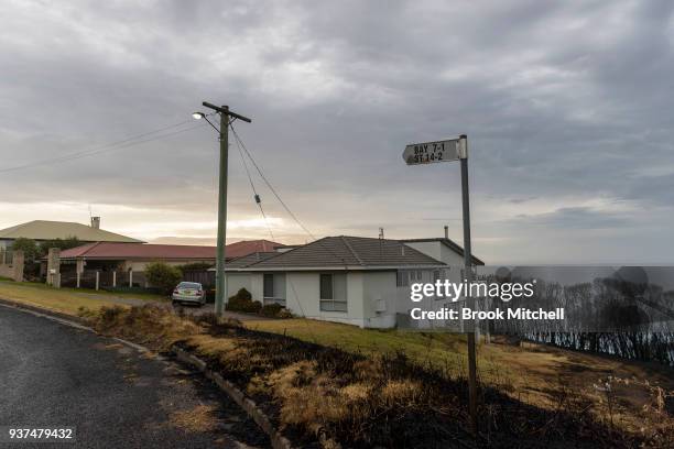 Burnt grassland on the Tathra headland on March 25, 2018 in Tathra, Australia. A bushfire which started on 18 March destroyed 65 houses, 35 caravans...