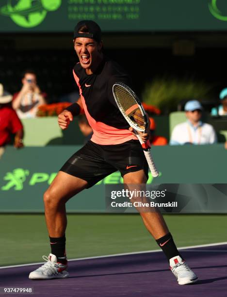 Thanasi Kokkinakis of Australia celebrates match point against Roger Federer of Switzerland in their second round match during the Miami Open...