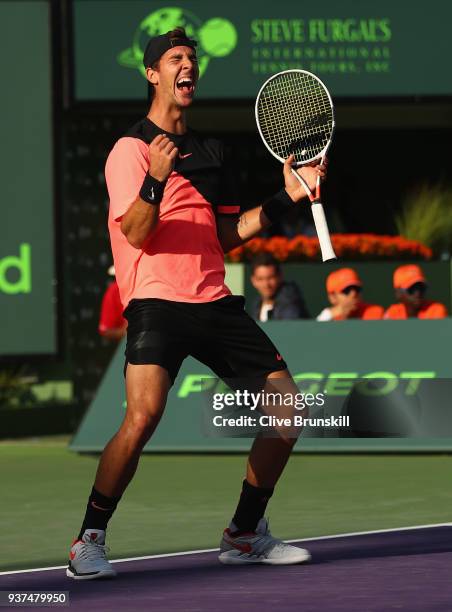 Thanasi Kokkinakis of Australia celebrates match point against Roger Federer of Switzerland in their second round match during the Miami Open...