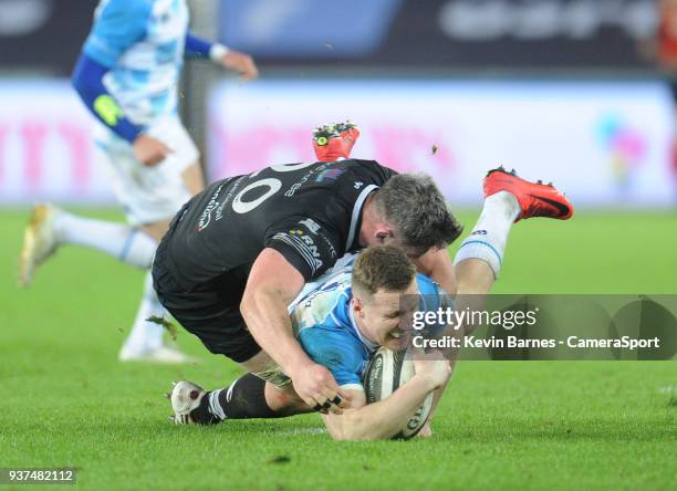 Leinster's Rory O'Loughlin is tackled by Ospreys' Rob McCusker during the Guinness PRO14 Round 18 match between Ospreys and Leinster Rugby at Liberty...