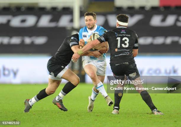 Leinster's Barry Daly is tackled by Ospreys' Owen Watkin and Kieron Fonotia during the Guinness PRO14 Round 18 match between Ospreys and Leinster...
