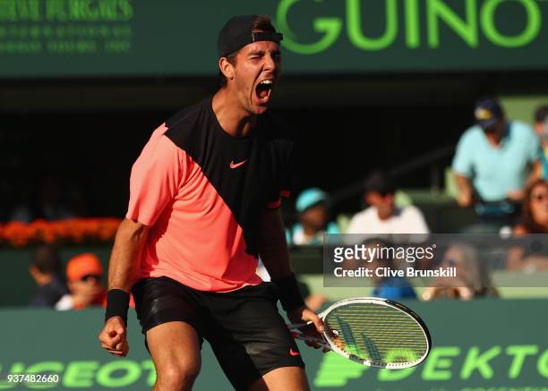 Thanasi Kokkinakis of Australia celebrates match point against Roger Federer of Switzerland in their second round match during the Miami Open...