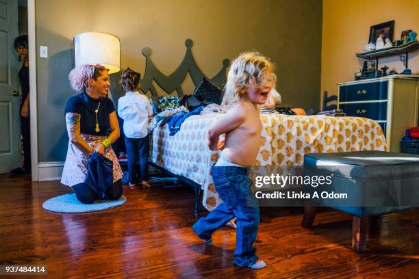 children playing in domestic bedroom - louisiana home stock pictures, royalty-free photos & images