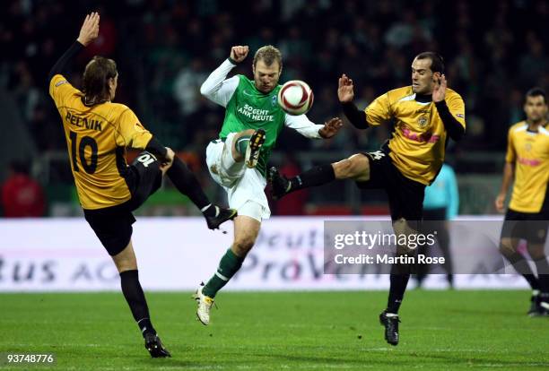 Daniel Jensen of Bremen, Nejc Pecnik and Ruben Micael of Funchal compete for the ball during the UEFA Europa League Group L match between Werder...