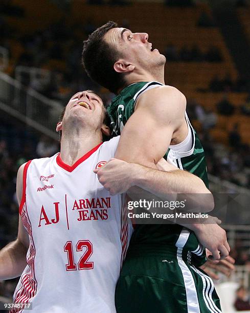 Mason Rocca, #12 of Armani Jeans Milano competes with Nikola Pekovic, #14 of Panathinaikos during the Euroleague Basketball Regular Season 2009-2010...