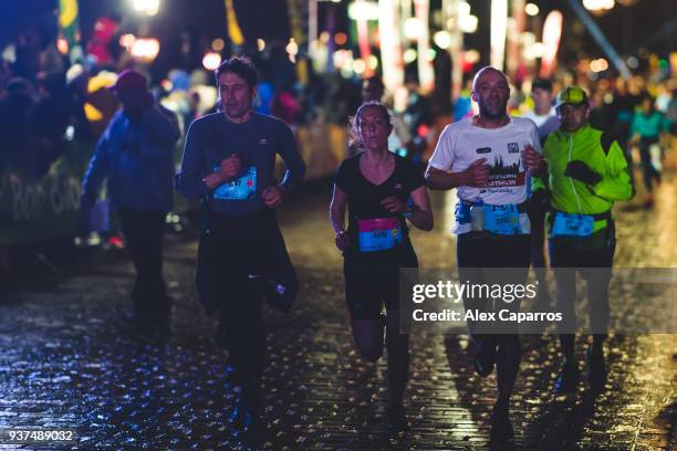 Athletes react as the finish the race during Marathon de Bordeaux Metropole 2018 on March 24, 2018 in Bordeaux, France.